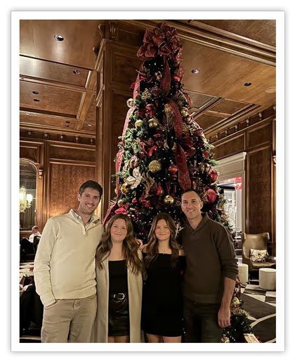 Cappos in front of tree