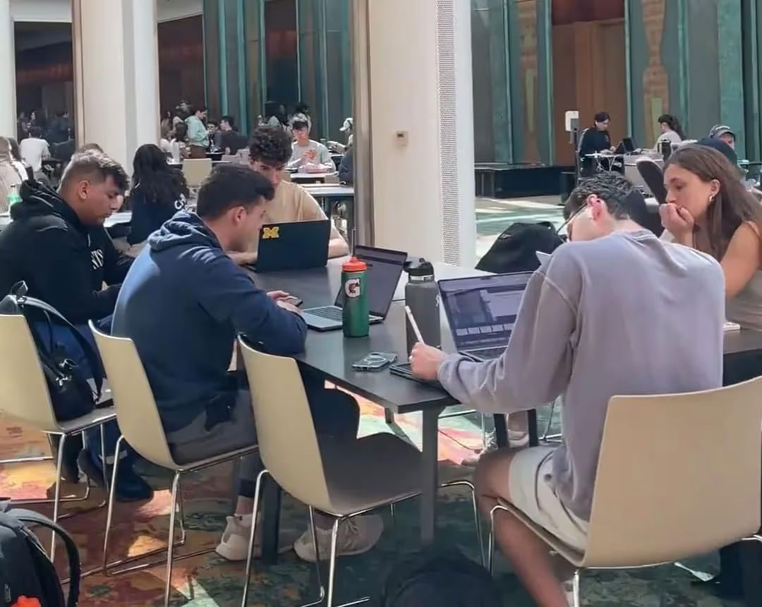 Students sitting around table and studying
